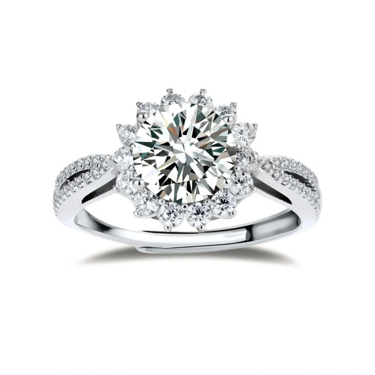 Close-up of sterling silver halo ring with brilliant round moissanite center stone surrounded by smaller accent stones